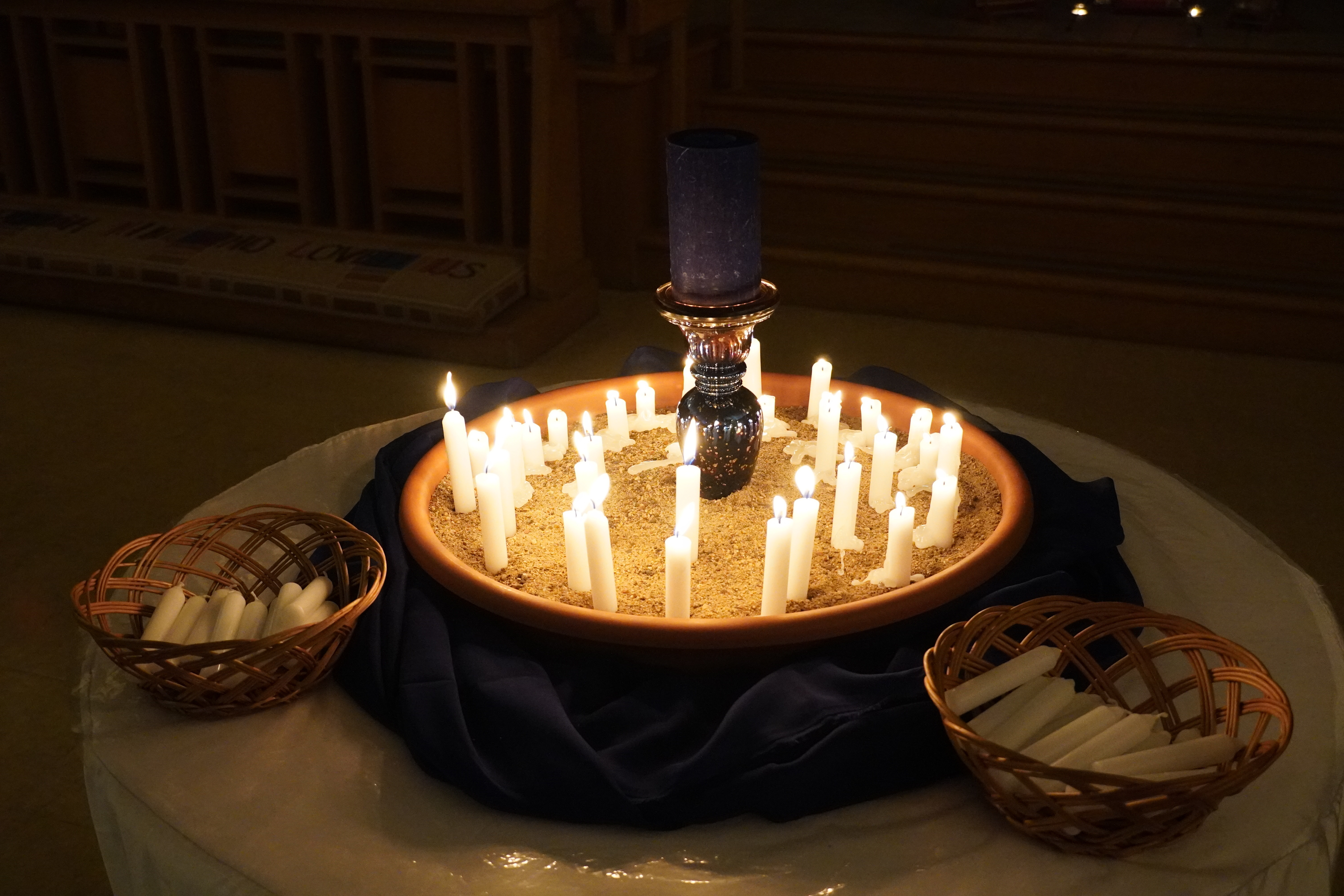 Votive candles in sand